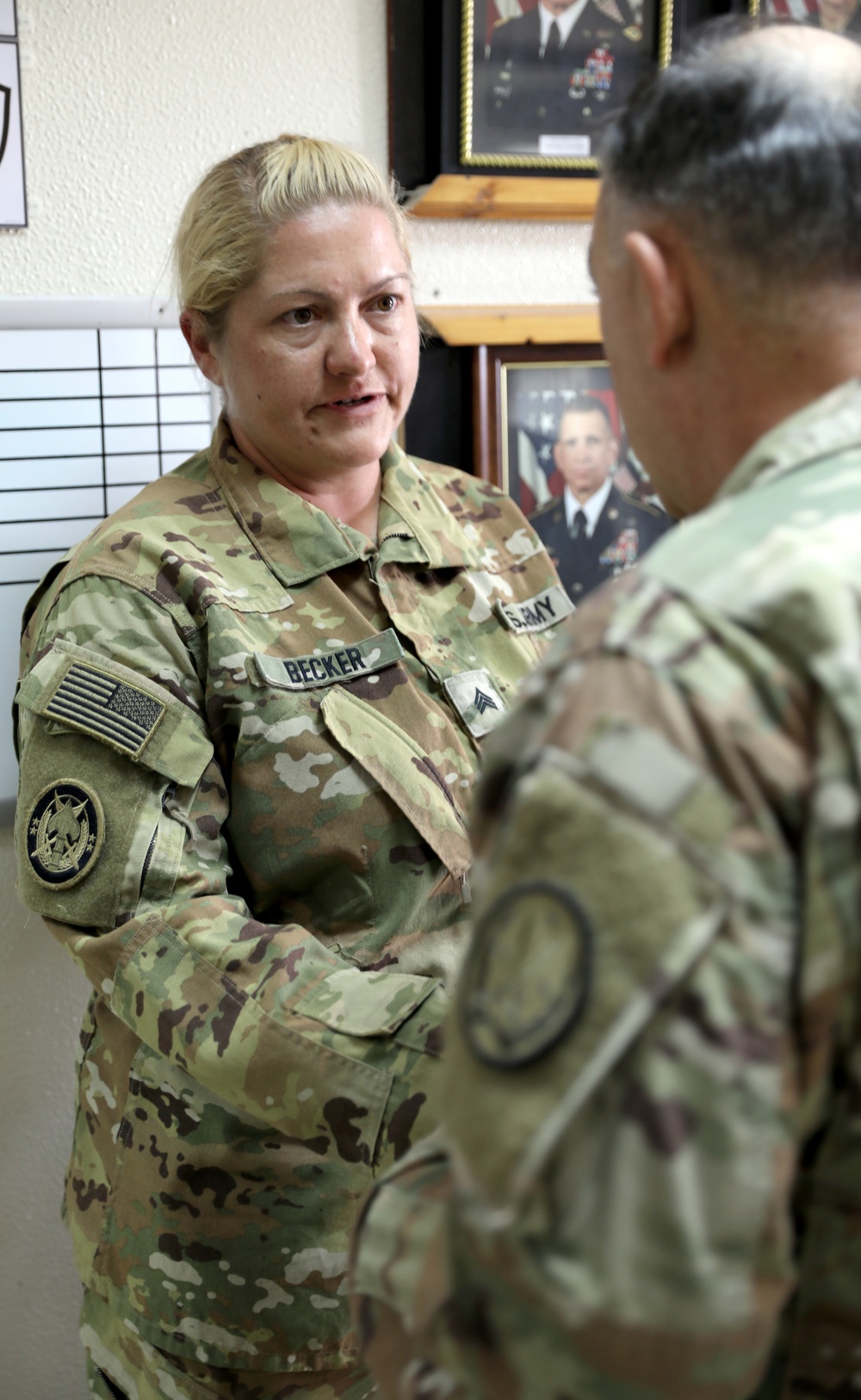 Lt. Gen. Paul Calvert coins Soldiers of Task Force Raptor at Camp Buehring