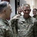 Lt. Gen. Paul Calvert coins Soldiers of Task Force Raptor at Camp Buehring