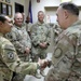 Lt. Gen. Paul Calvert coins Soldiers of Task Force Raptor at Camp Buehring
