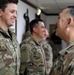 Lt. Gen. Paul Calvert coins Soldiers of Task Force Phoenix, 40th Combat Aviation Brigade at Camp Buehring