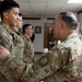 Lt. Gen. Paul Calvert coins Soldiers of Task Force Phoenix, 40th Combat Aviation Brigade at Camp Buehring