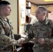 Lt. Gen. Paul Calvert coins Soldiers of Task Force Phoenix, 40th Combat Aviation Brigade at Camp Buehring