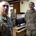 Lt. Gen. Paul Calvert coins Soldiers of Task Force Phoenix, 40th Combat Aviation Brigade at Camp Buehring