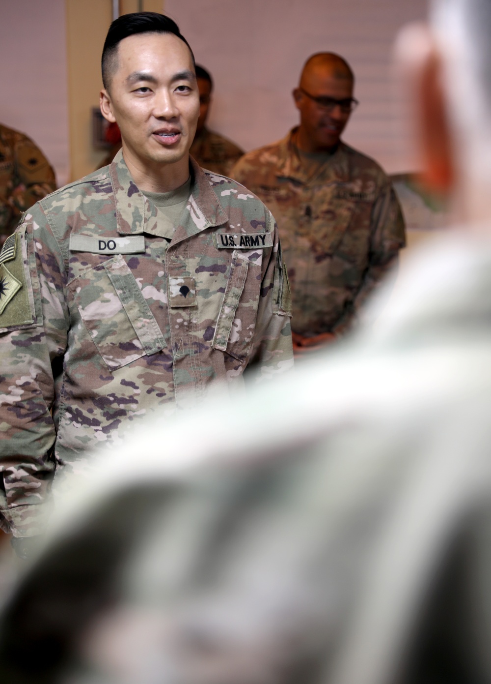 Lt. Gen. Paul Calvert coins Soldiers of Task Force Phoenix, 40th Combat Aviation Brigade at Camp Buehring