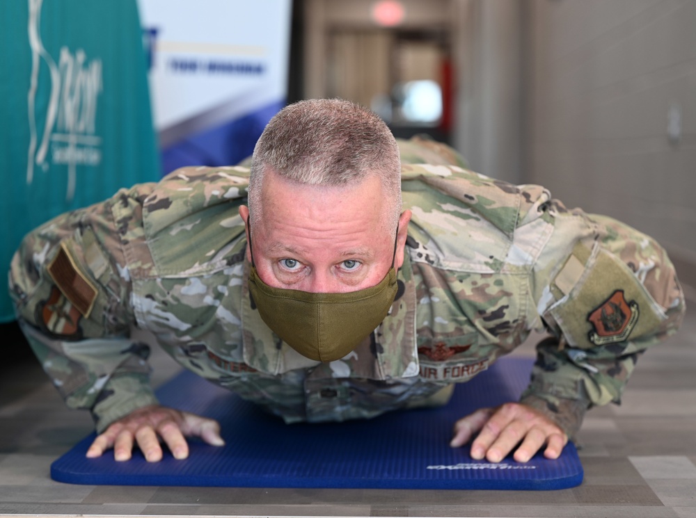 Command Chief does push-ups  a Suicide Prevention Awareness event.