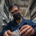 Mustin Sailor Conducts a Small Parts Inventory