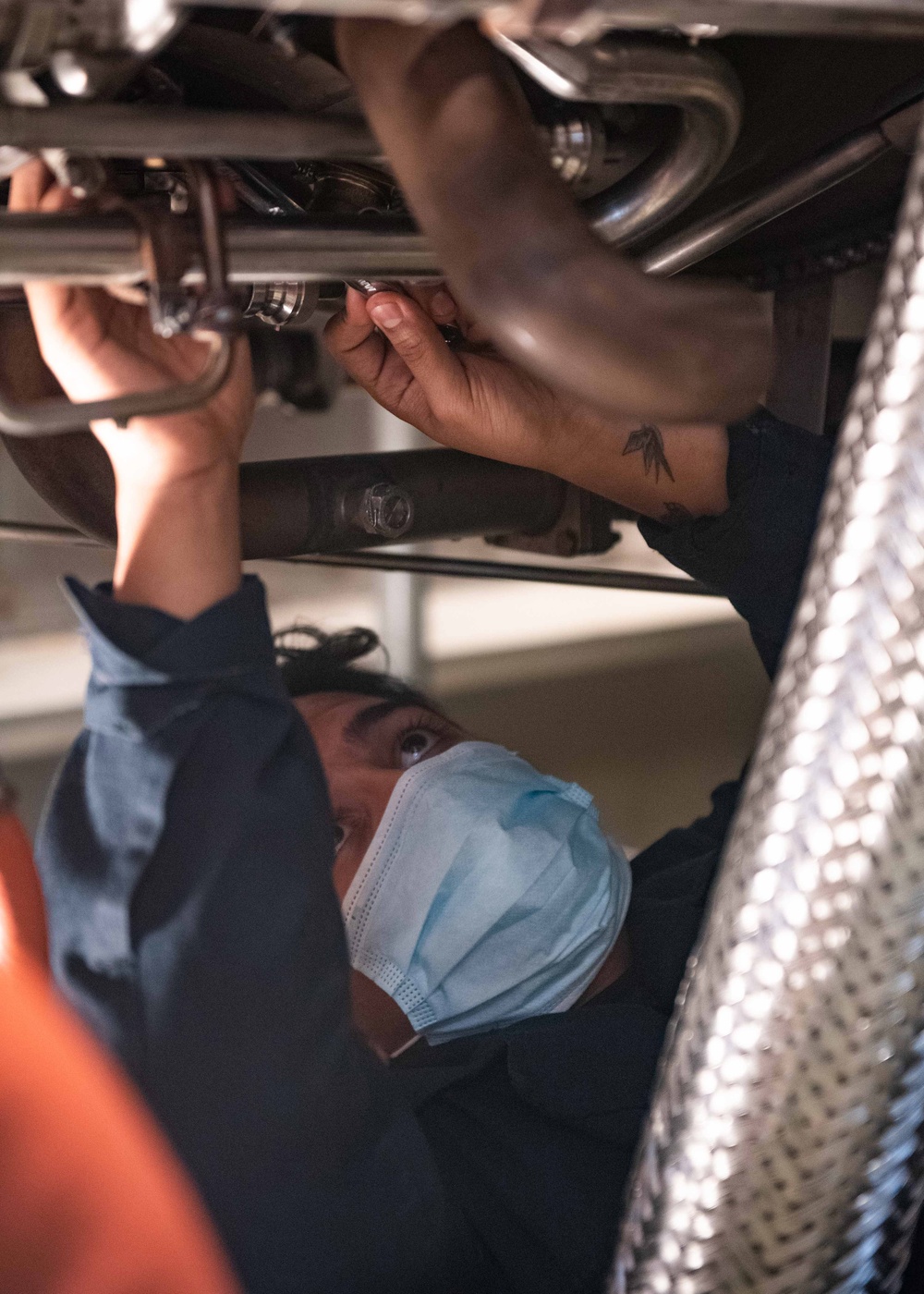 Mustin Sailor Reinstalls Fittings Following a Water Wash