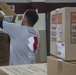 Volunteers unload donations at the National Guard armory