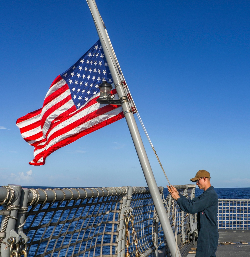 USS Billings Sailor Lowers the Ensign to Half-Mast During a 9/11 Remembrance Ceremony