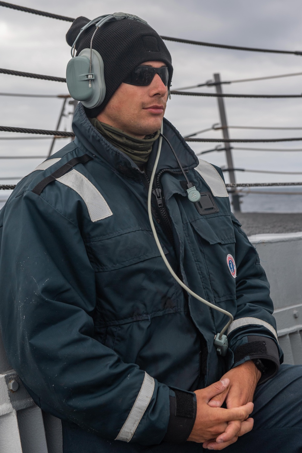 USS Mustin Sailor Stands Aft Lookout Watch