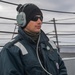 USS Mustin Sailor Stands Aft Lookout Watch