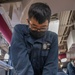 USS Mustin Sailor Practices Chest Compressions During First Aid Training