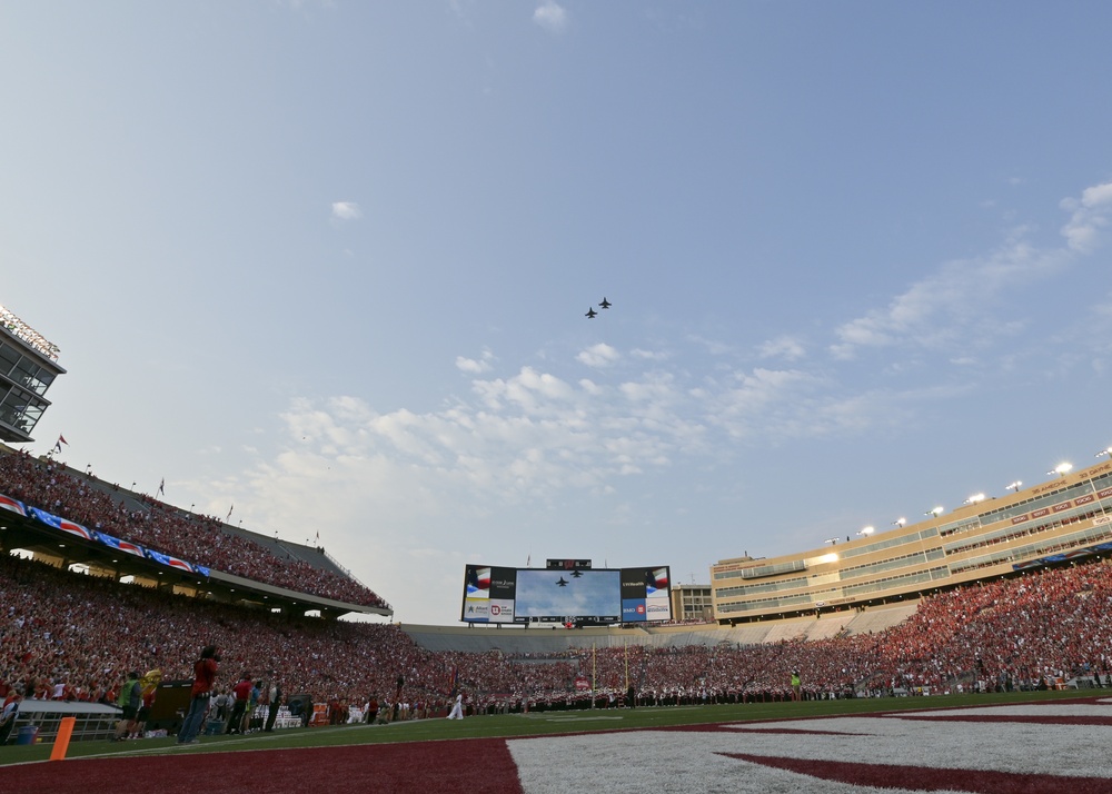 F-16s fly over Camp Randall Stadium as part of 9/11 tribute
