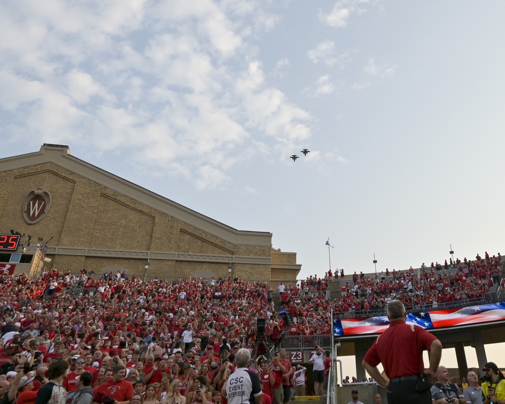 F-16s fly over Camp Randall Stadium as part of 9/11 tribute