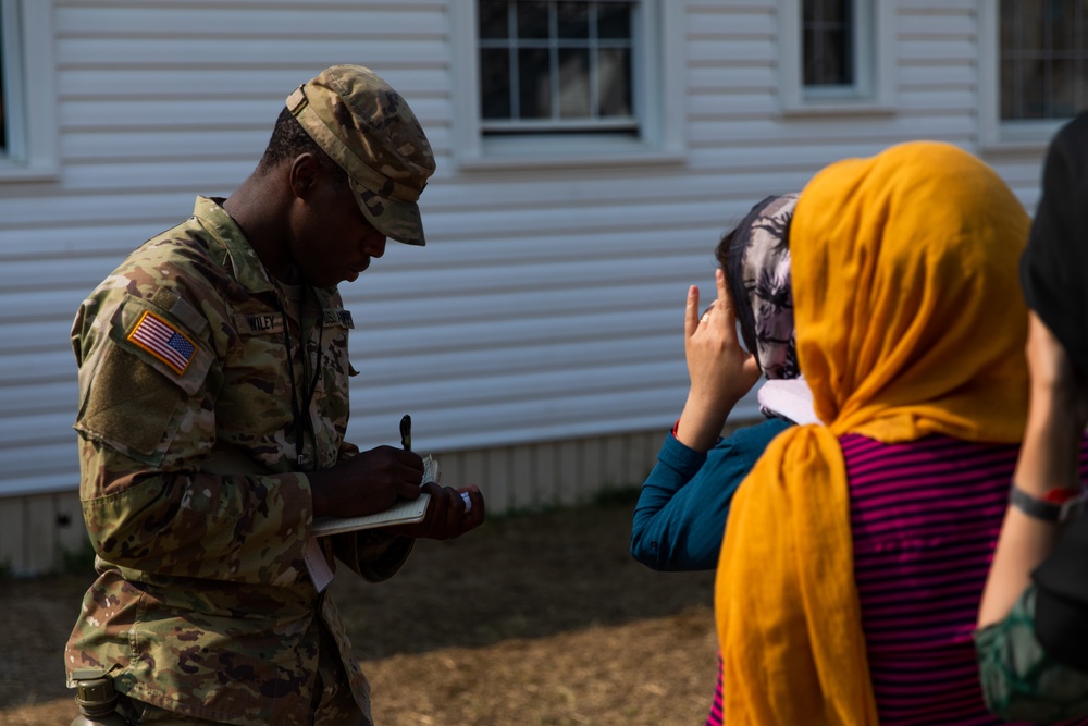 U.S. Army Soldier Tallies the Next Afghan to Recieve Donations During Operation Allies Welcome at Fort Pickett, Virginia.