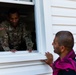 U.S. Army Soldier Speaks with Afghan on what is Available for Donations During Operation Allies Welcome at Fort Pickett, Virginia.