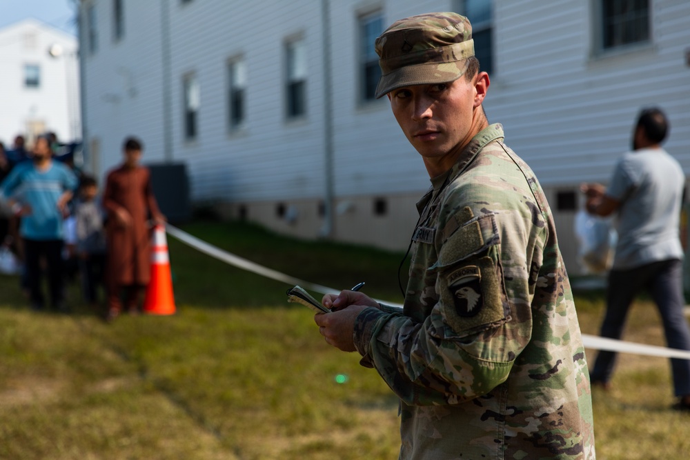 U.S. Army Soldier Tallies Afghan Personnel as they Recieve Donations During Operation Allies Welcome at Fort Pickett, Virginia.