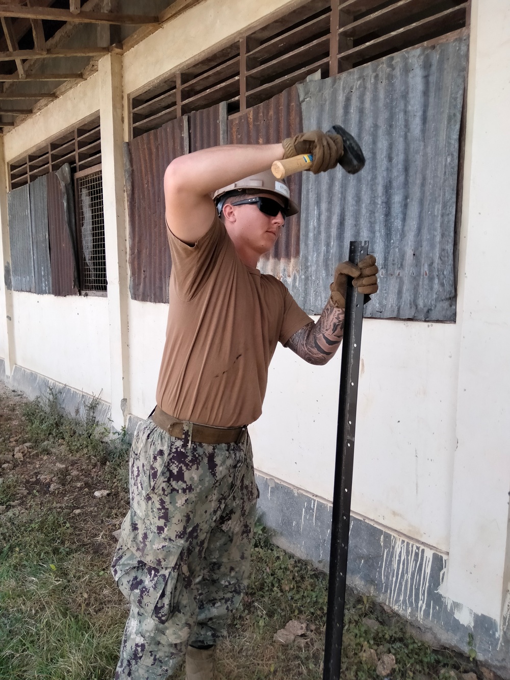 U.S. Navy Seabees with NMCB-5 build a schoolhouse