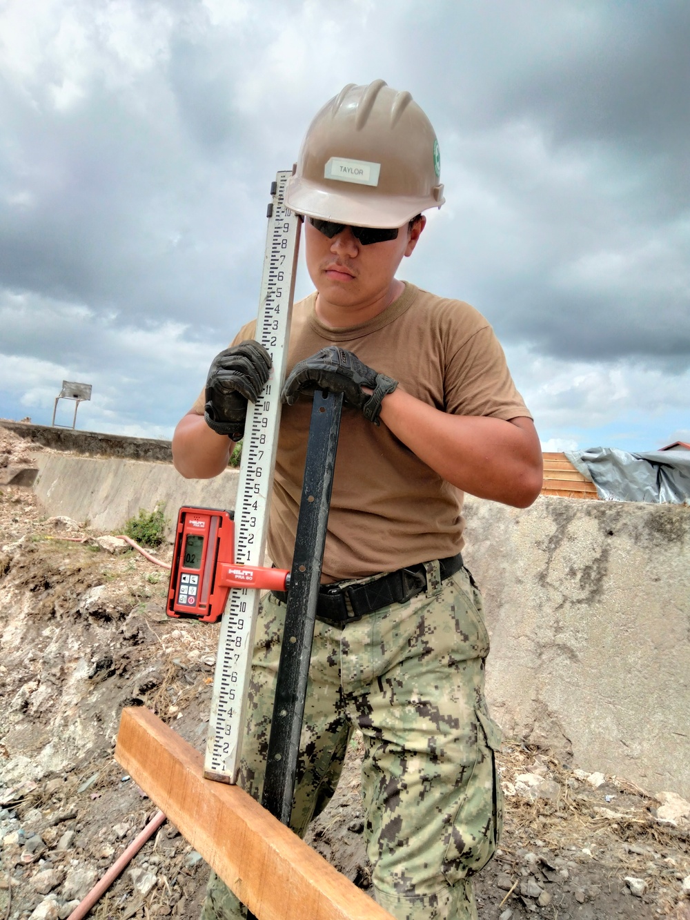 U.S. Navy Seabees with NMCB-5 build a schoolhouse