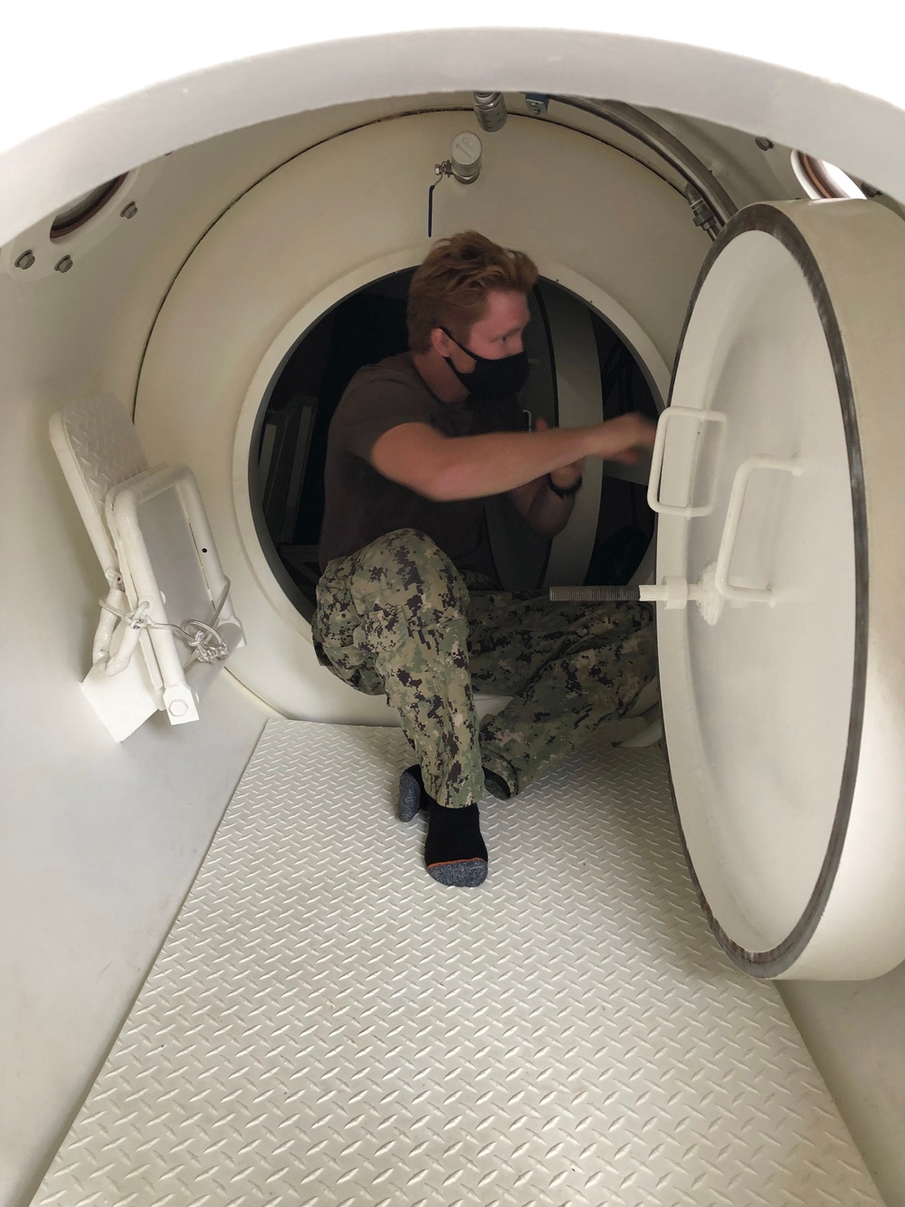 MDSU 2 Sailor Inspects the Inside of the Chilean Diver Recompression Chamber