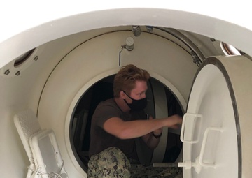 MDSU 2 Sailor Inspects the Inside of the Chilean Diver Recompression Chamber
