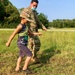 Soldier teaches child to march