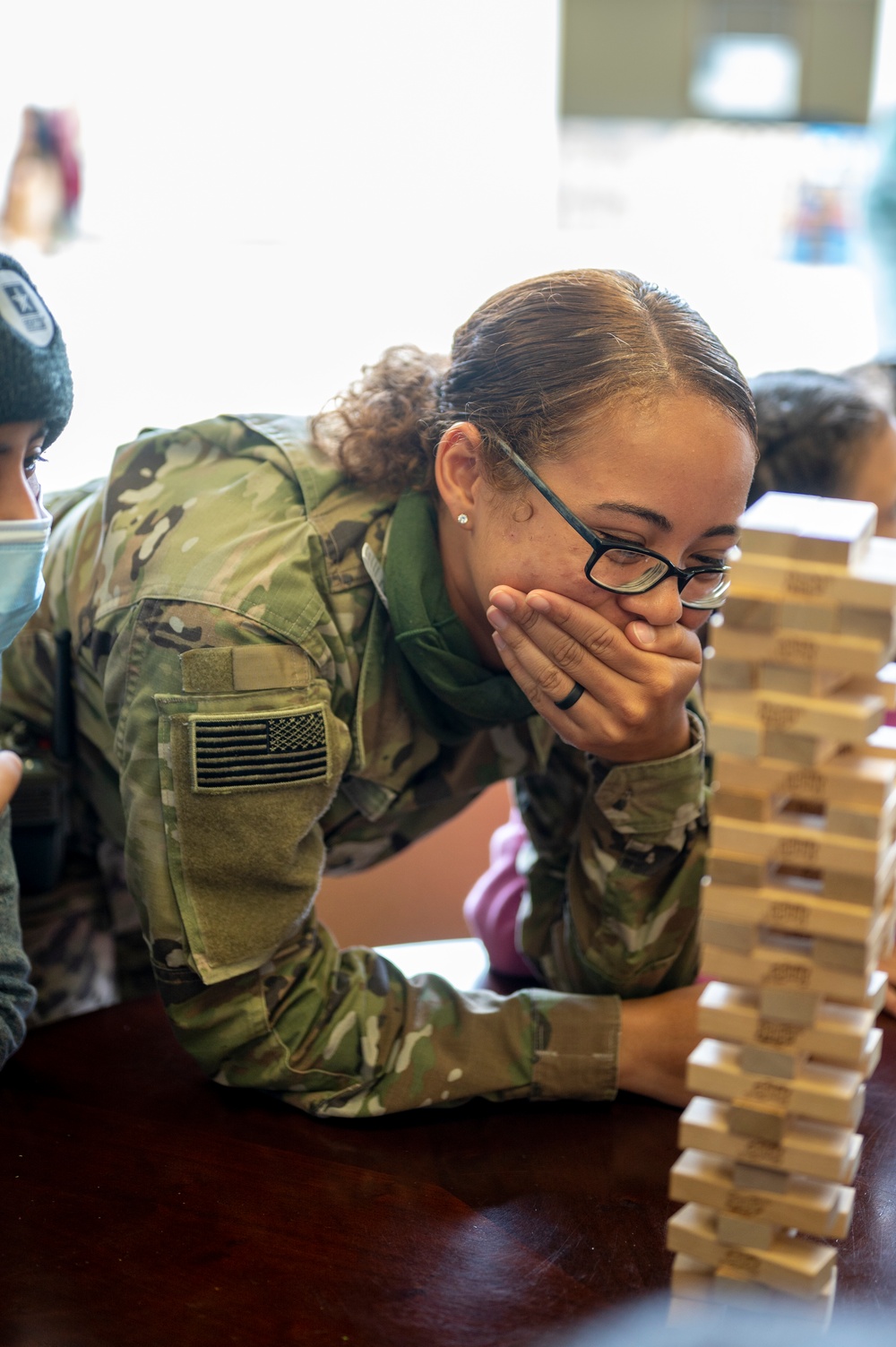 Task Force McCoy Soldiers play games with guests