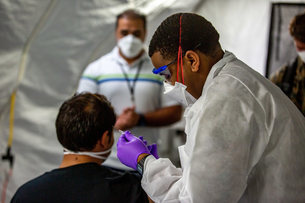 U.S. service members provide COVID vaccinations for Afghan civilians