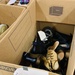 Donated shoes paired up and separated by size are ready to be given out to Families on Doña Ana Village, Sept. 13.