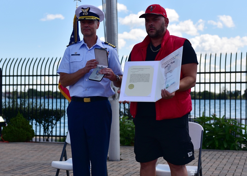 Coast Guard honors Michigan man who saved three girls struggling in the Detroit River