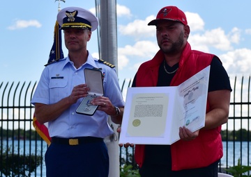 Coast Guard honors Michigan man who saved three girls struggling in the Detroit River