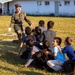 U.S. service members play with Afghan children during Operation Allies Welcome