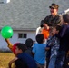 U.S. service members play with Afghan children during Operation Allies Welcome