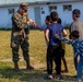 U.S. service members play with Afghan children during Operation Allies Welcome