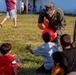 U.S. service members play with Afghan children during Operation Allies Welcome