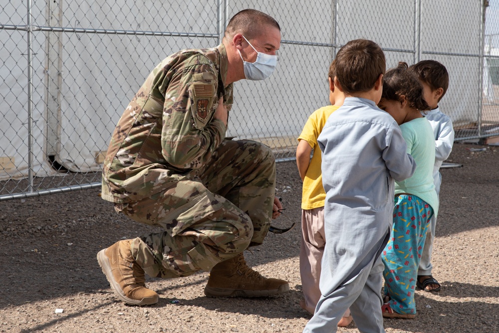 Airman spends time interacting with children in Aman Omid