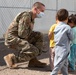 Airman spends time interacting with children in Aman Omid