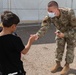 Airman spends time interacting with children in Aman Omid