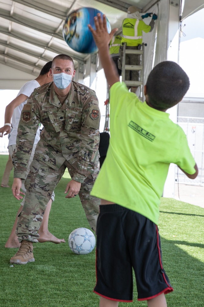 Airman spends time interacting with children in Aman Omid