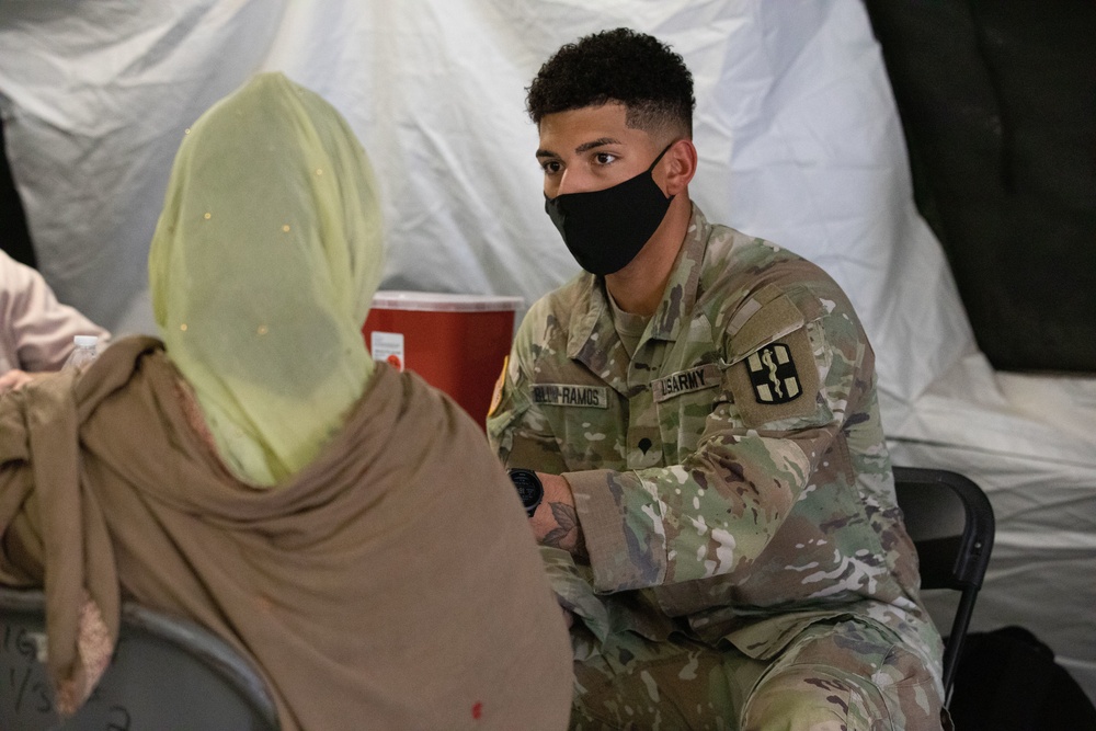 Afghan evacuees are vaccinated at Fort Bliss' Doña Ana complex