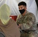 Afghan evacuees are vaccinated at Fort Bliss' Doña Ana complex