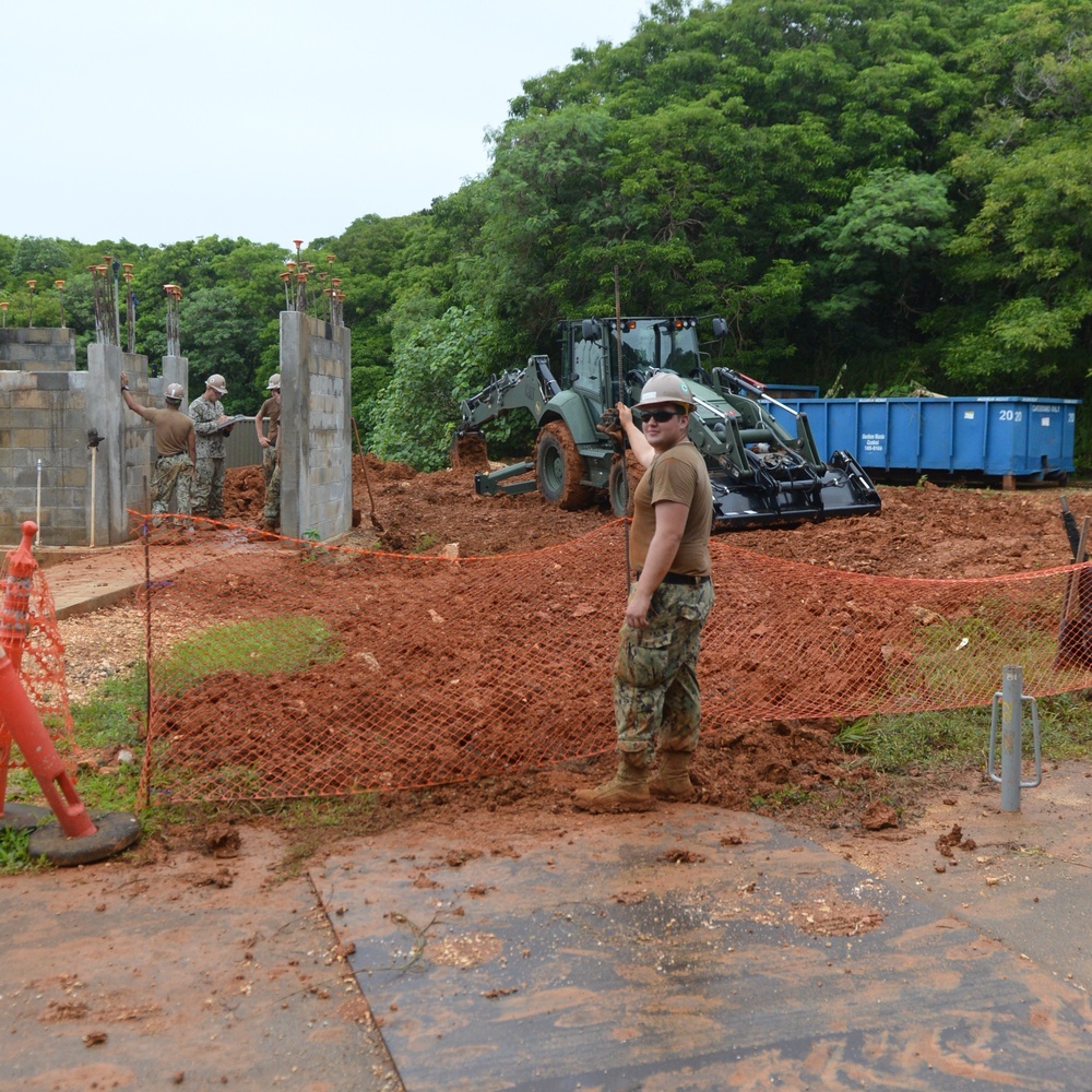 NMCB One Seabee working on the DET Guam Outhouse project