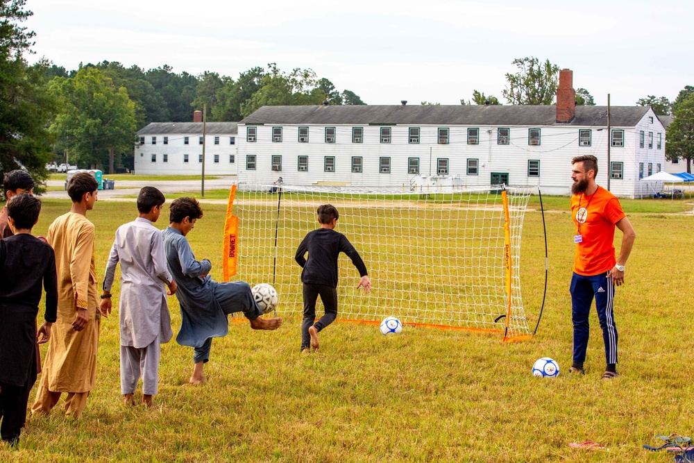 Afghan civilians attend Charlotte Eagles soccer camp during Operation Allies Welcome