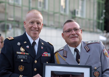 USAREUR-AF Band &amp; Chorus gifts challenge coin to Bulgarian military band.