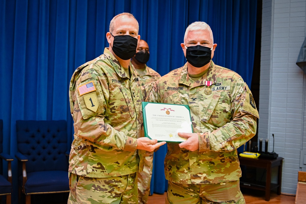 Former U.S. Army Reserve Cyber Protection Brigade Commander Col. Benjamin Bourgoyne receives the Meritorious Service Medal