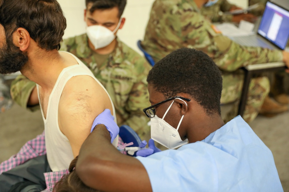 21st TSC gives Afghan evacuees Measles vaccine