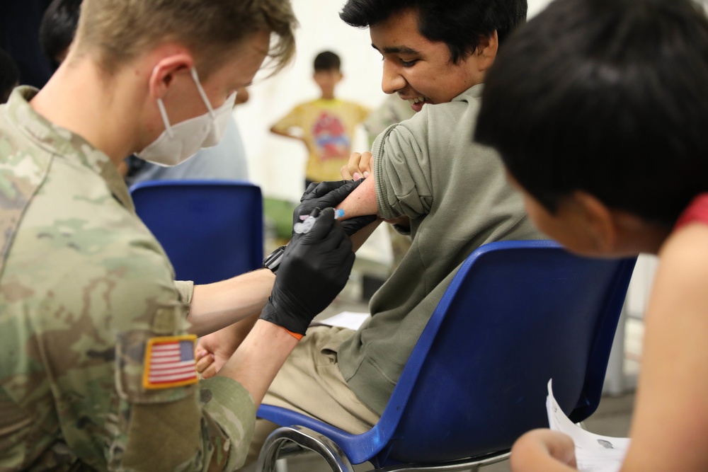 21st TSC gives Afghan evacuees Measles vaccine