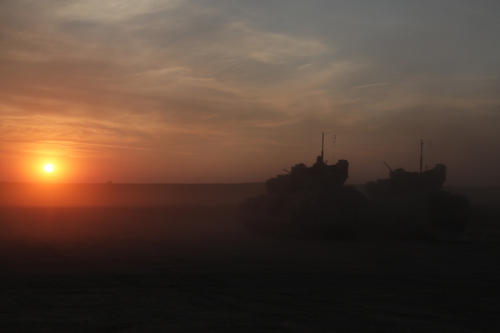 M2A3 Bradley IFVs at sunrise