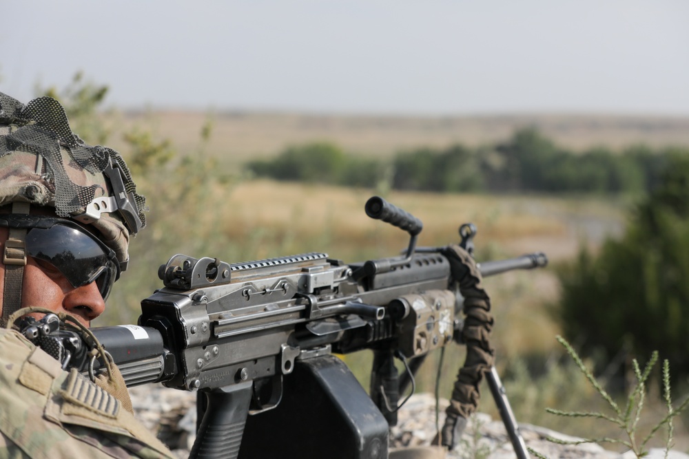 Squad Automatic Weapon provides support by fire during platoon live fire exercises