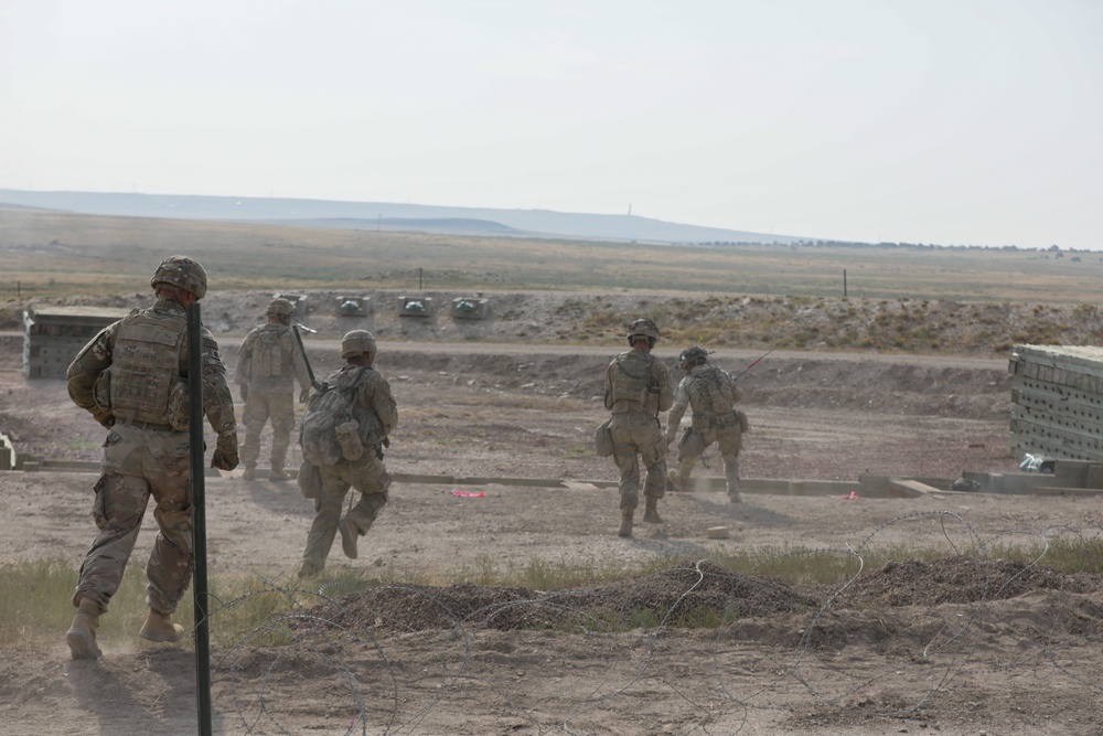 Dismounts move to trench during platoon live fire exercises